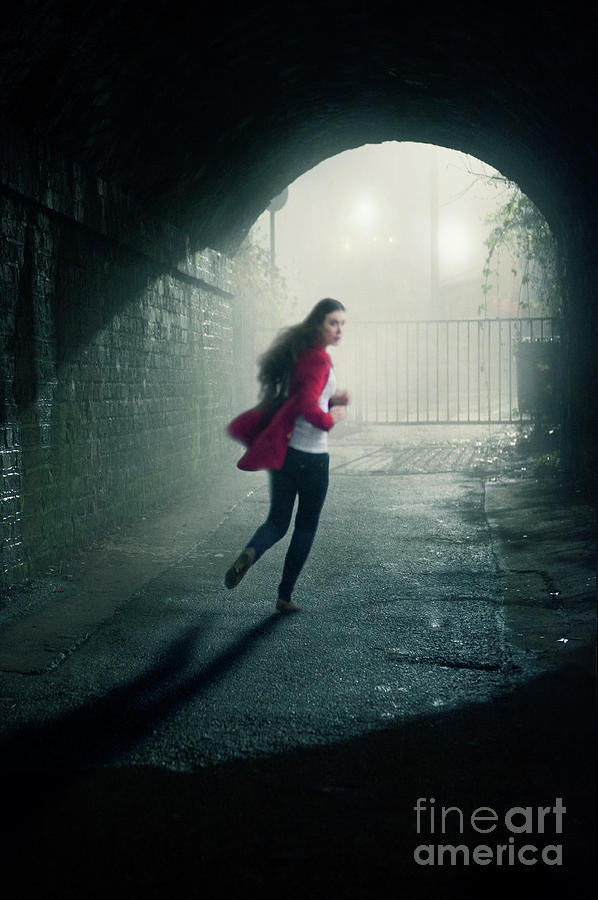 Young Woman Running Through A Tunnel At Night Photograph by Lee Avison