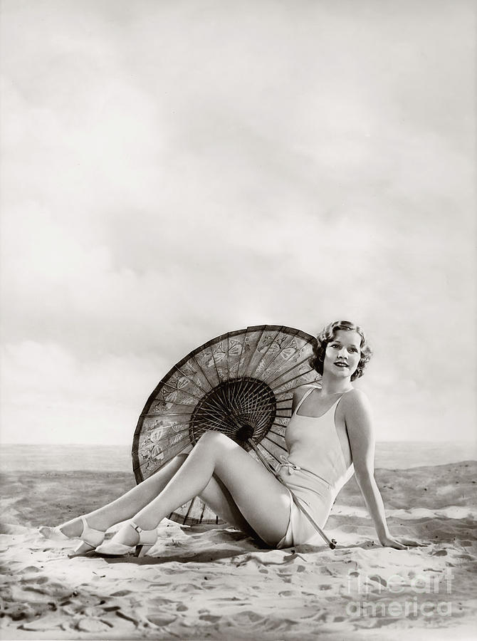Ziegfeld Model sun bathing on the beach  by Alfred Cheney Johnston Photograph by Vintage Collectables