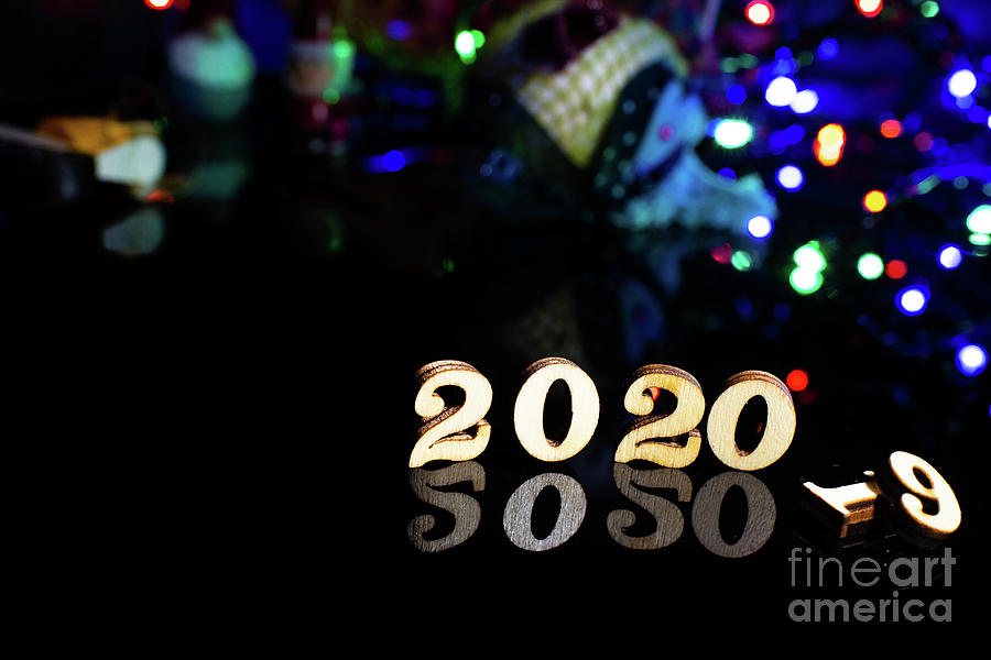 2020 happy new year wood number Christmas decoration and snow with bright background and copy space #1 Photograph by Joaquin Corbalan