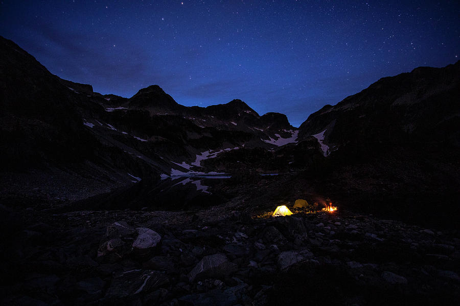 Mountain Photograph - A Campsite Glows On A Summer Night In The Mountains. #1 by Cavan Images