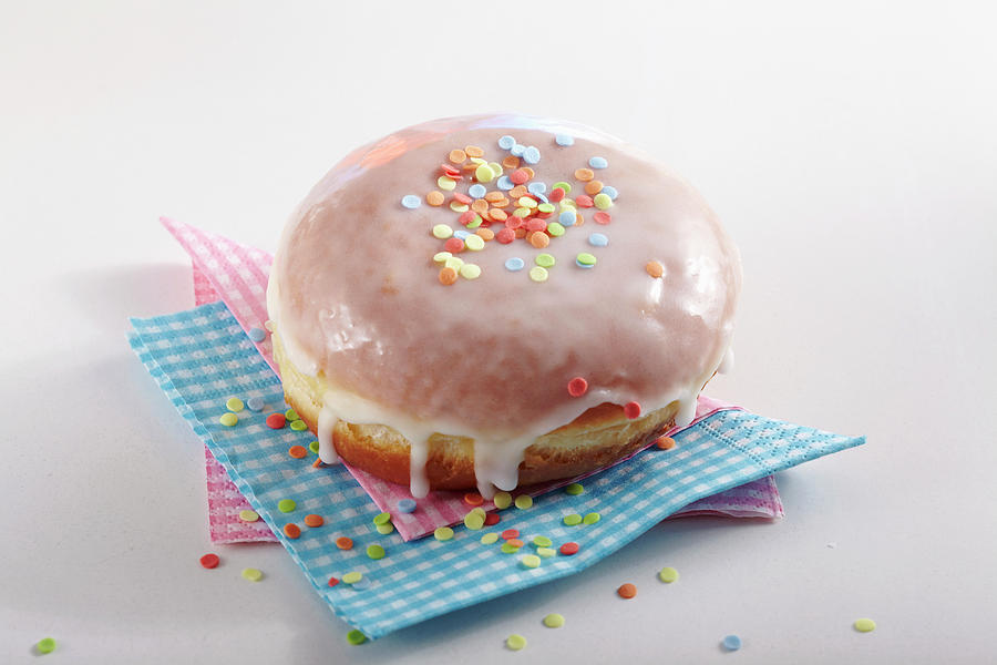 A Carnival Doughnut Decorated With Sugar Confetti #1 Photograph by Teubner Foodfoto