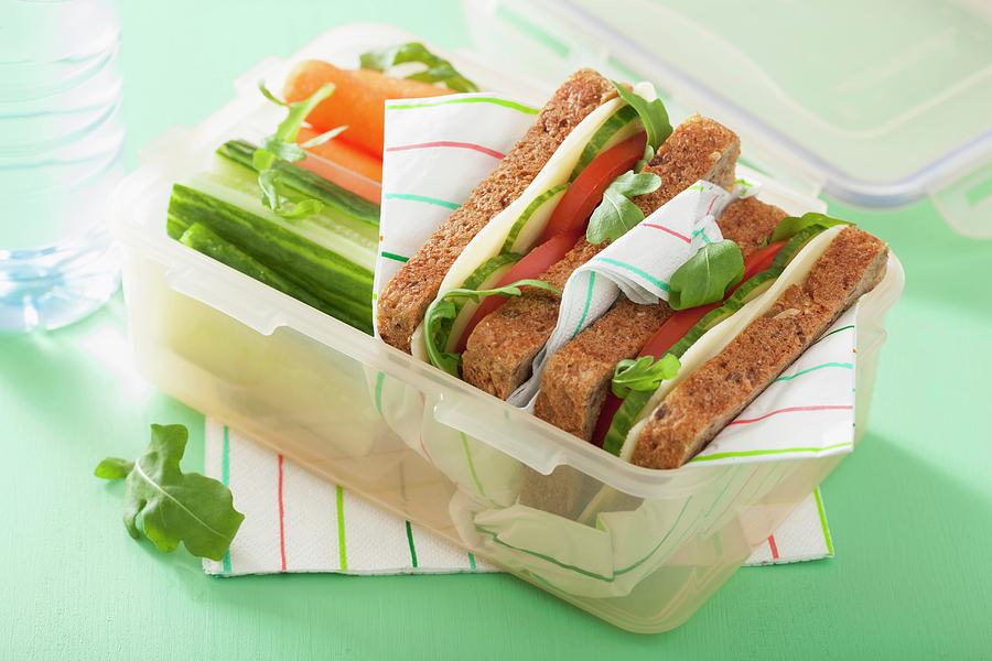 A Cheese Sandwich And Raw Vegetables In A Lunch Box #1 Photograph by Olga Miltsova