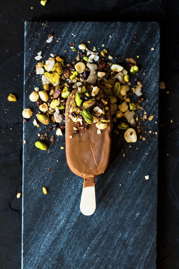 A Chocolate Ice Lolly With Dukkah a Nut And Spice Mix #1 Photograph by Hein Van Tonder