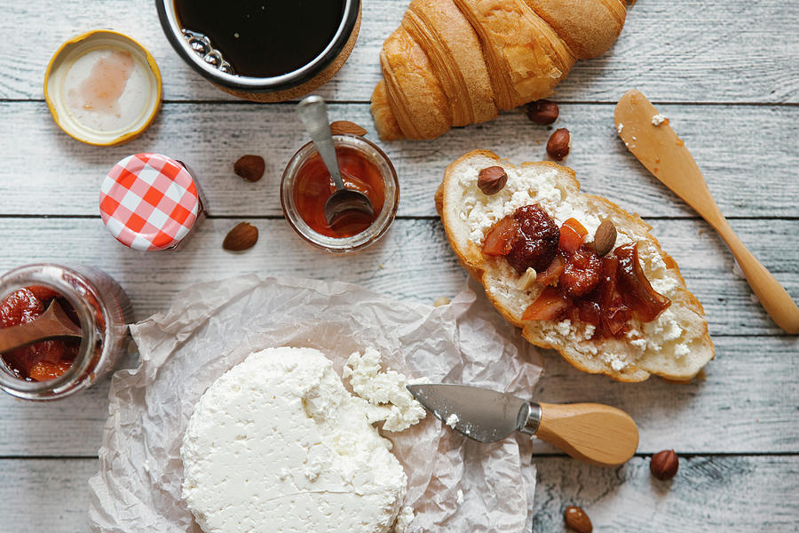 A Croissant With Goats Cream Cheese And Fig Jam #1 Photograph by Kuzmin5d