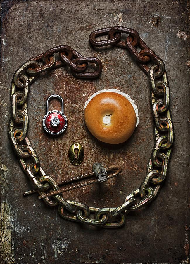 A Face Made From A Bagel, An Iron Chain And A Padlock #1 Photograph by Colin Cooke