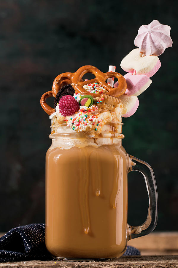 A Freak Shake With Coffee, Cream And Colourful Sweets #1 Photograph by Valeria Aksakova