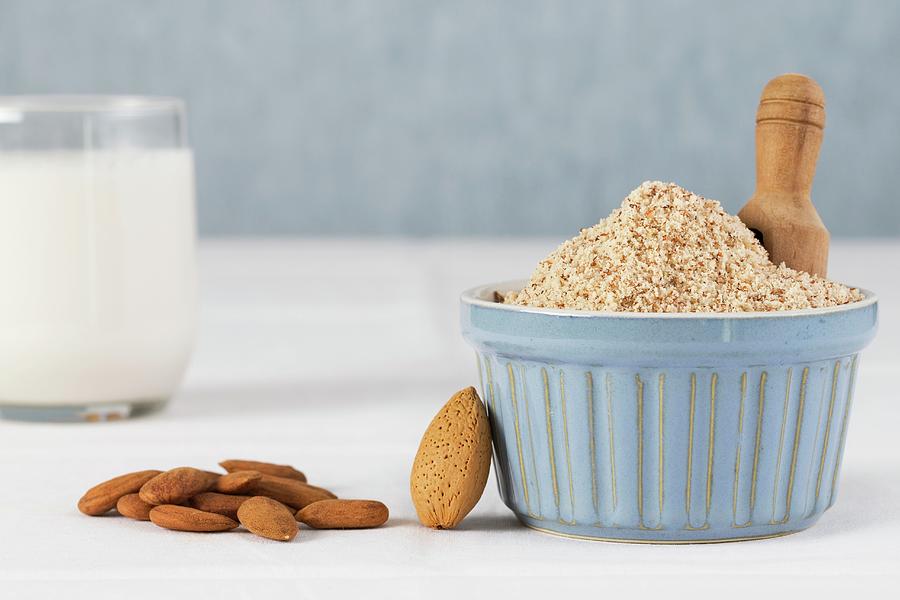 A Glass Of Almond Milk With Whole And Grated Almonds #1 Photograph by Lydie Besancon