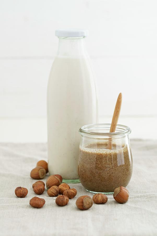 A Jar Of Hazelnut Mousse And Hazelnut Milk In A Glass Bottle #1 Photograph by Elisabeth Clfen