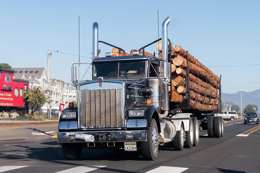 A Large Truck Transports Large Trunks On The Coast Of Oregon, Usrockaway Beach, Oregon, Usa - Octobe Photograph