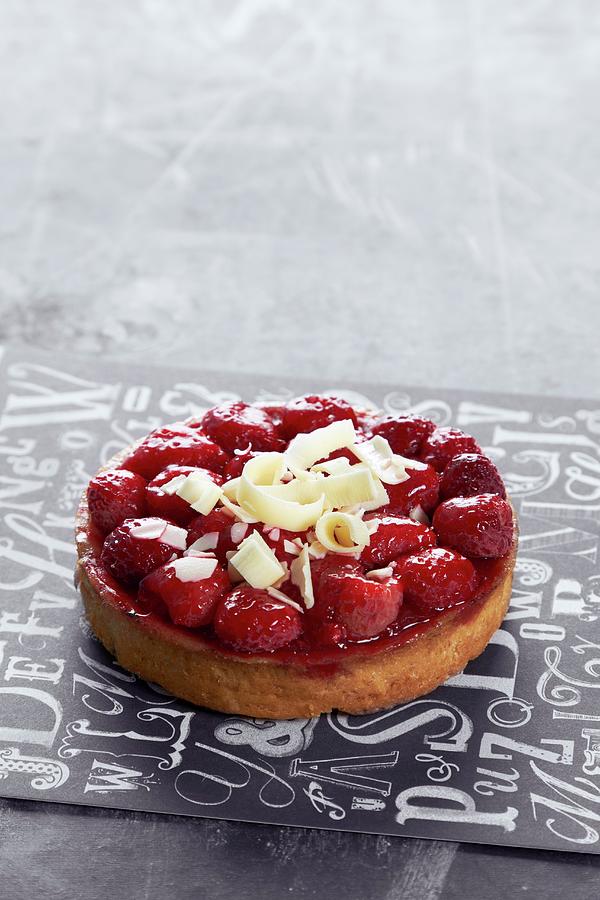 A Raspberry Tartlet Topped With White Chocolate #1 Photograph by Miriam Rapado