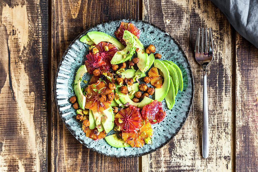 A Salad Of Avocado, Blood Orange, Roasted Chickpeas, Pistachios And Cress #1 Photograph by Sandra Rsch