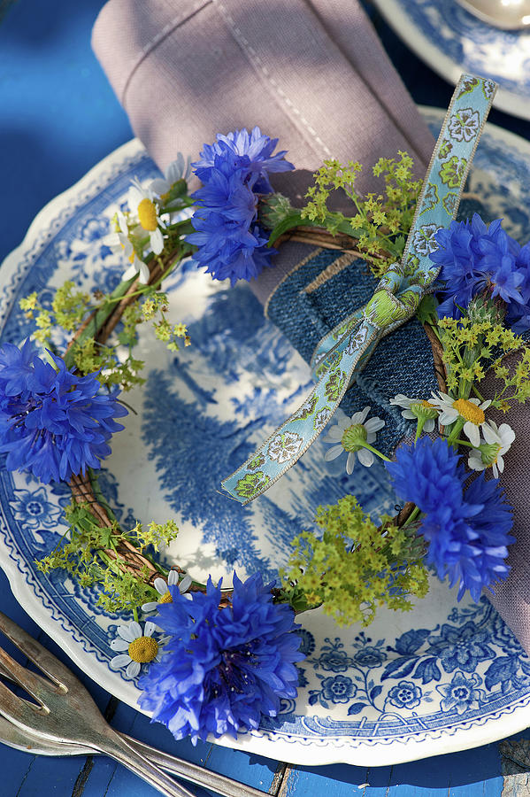 A Small Wreath Of Cornflowers, Ladys Mantle, And Chamomile As A Plate Decoration #1 Photograph by Elisabeth Berkau