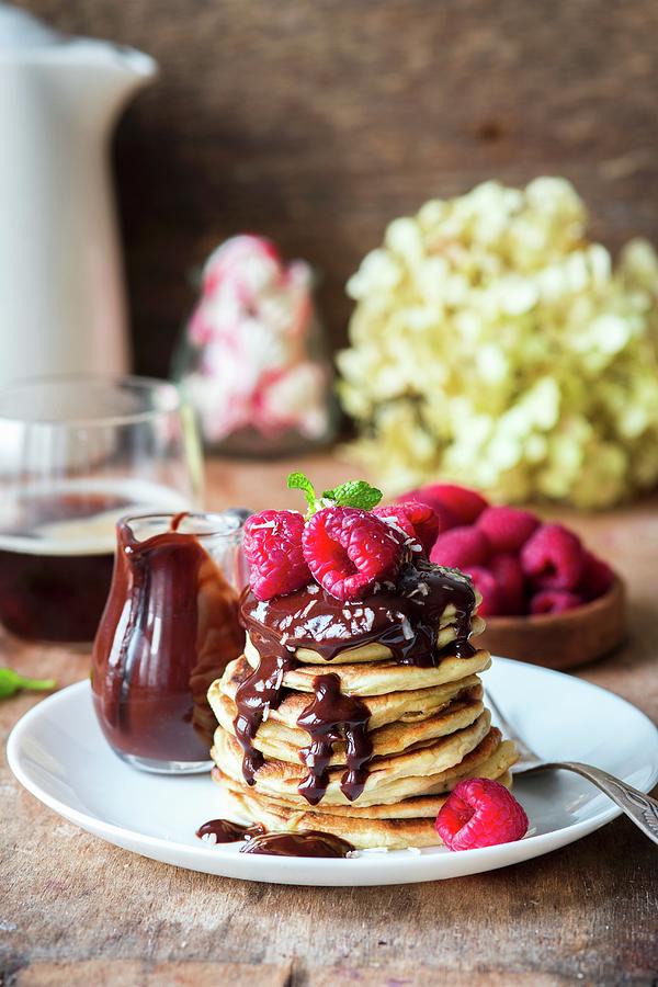 A Stack Of Pancakes With Chocolate Sauce And Raspberries #1 Photograph by Irina Meliukh