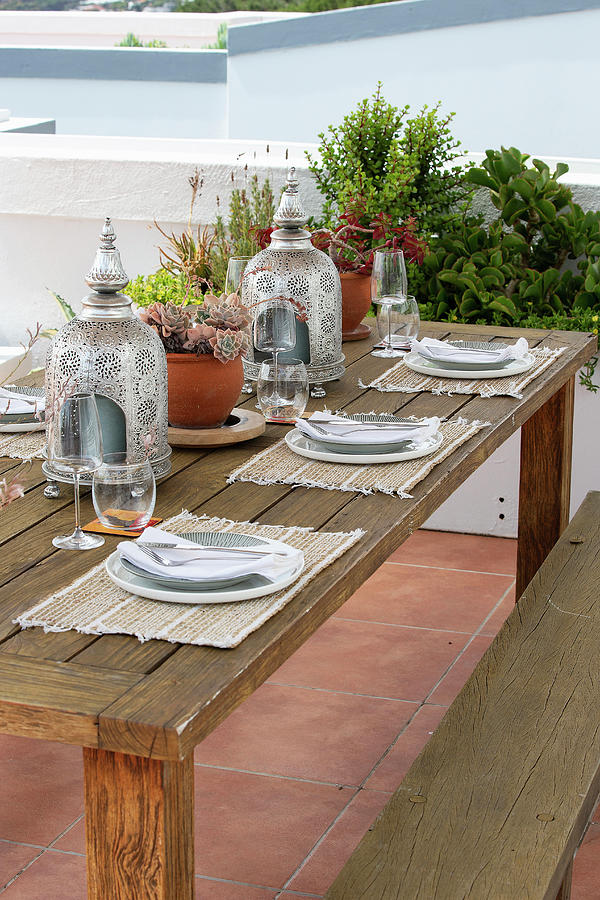 A Table Laid For A Meal On Raised Decking #1 Photograph by Great Stock!