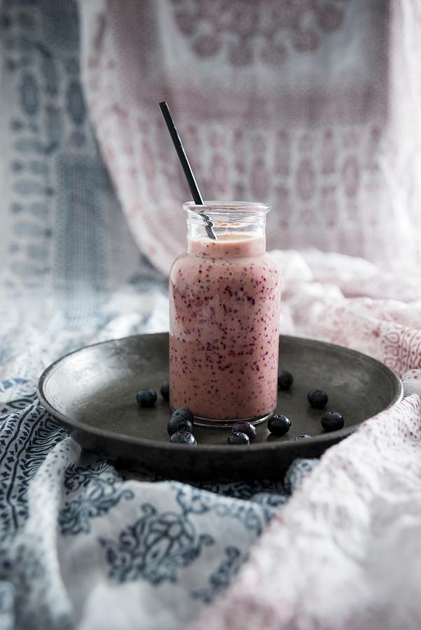 A Vegan Blueberry And Yoghurt Smoothie In A Glass Jar #1 Photograph by Kati Neudert