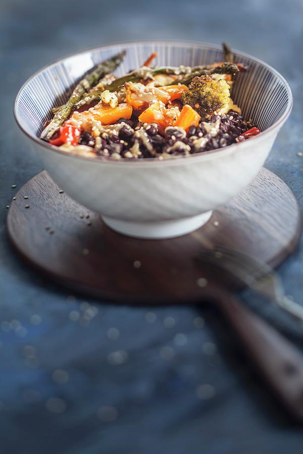 A Vegan Buddha Bowl With Black Rice, Toasted Vegetables And Tahini Sauce #1 Photograph by Susan Brooks-dammann