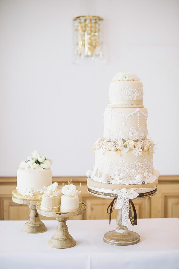 A Wedding Cake On A Restaurant Table #1 Photograph by Clara Tuma