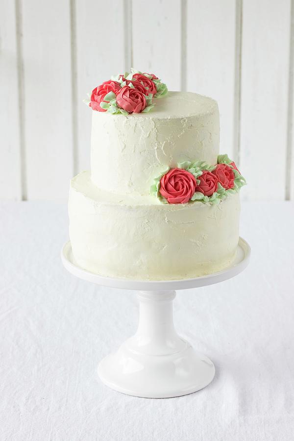 A Wedding Cake With Buttercream Roses #1 Photograph by Emma Friedrichs