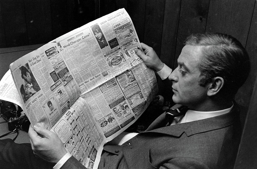 Actor Michael Caine Reading A Newspaper Photograph by Bill Ray Actor Michael Caine Reading A Newspaper Photograph by Bill Ray