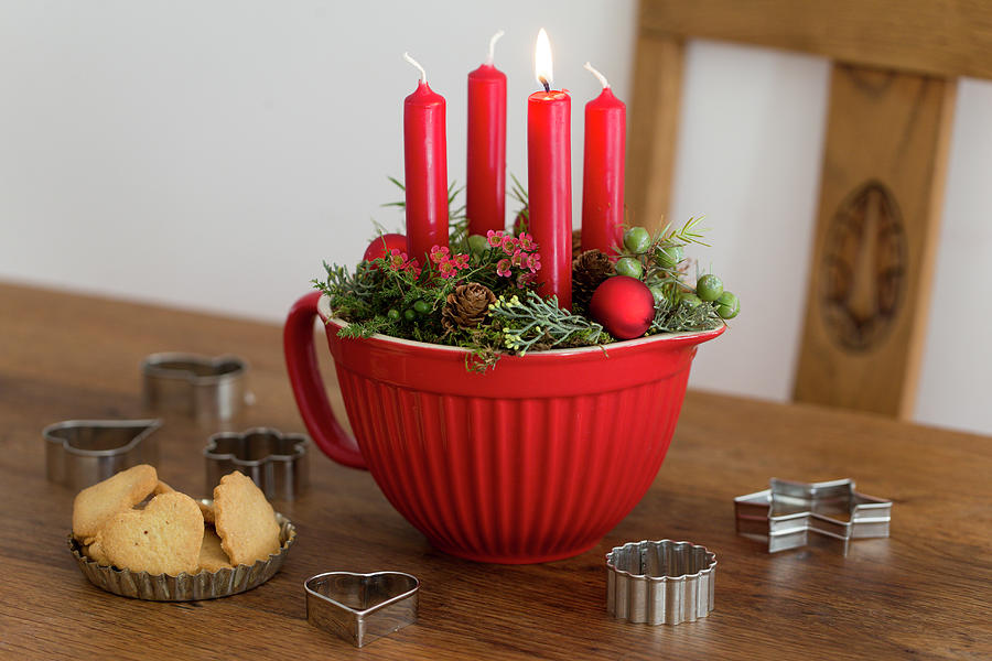Advent Arrangement Of Four Red Candles In Red Mixing Bowl #1 Photograph by Iris Wolf