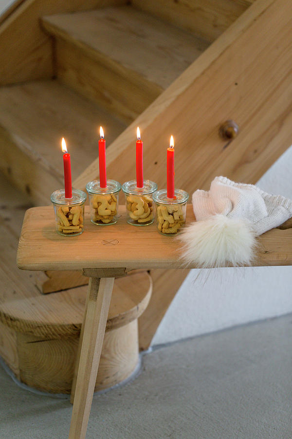 Alternative Advent Wreath Made From Candles On Mason Jars Containing Biscuit Numbers 1-4 #1 Photograph by Iris Wolf