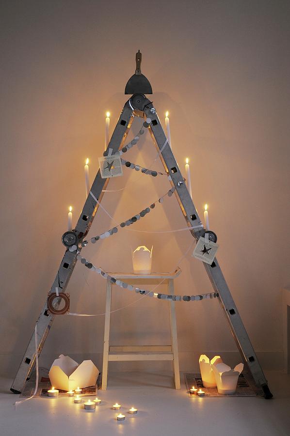Alternative Christmas Tree Made From Folding Ladder And Take-away Cartons Used As Candle Lanterns #1 Photograph by James Stokes