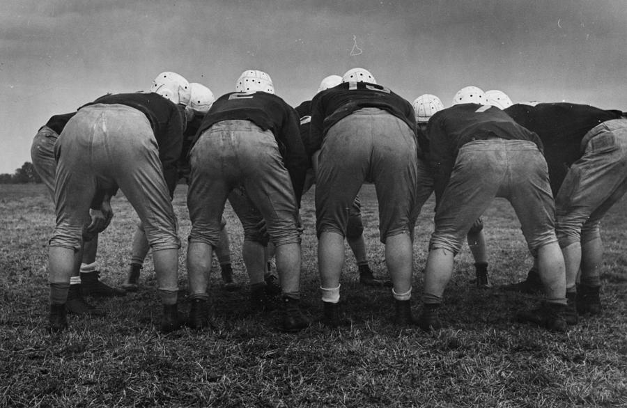 American Huddle Photograph by Kurt Hutton American Huddle Photograph by Kurt Hutton