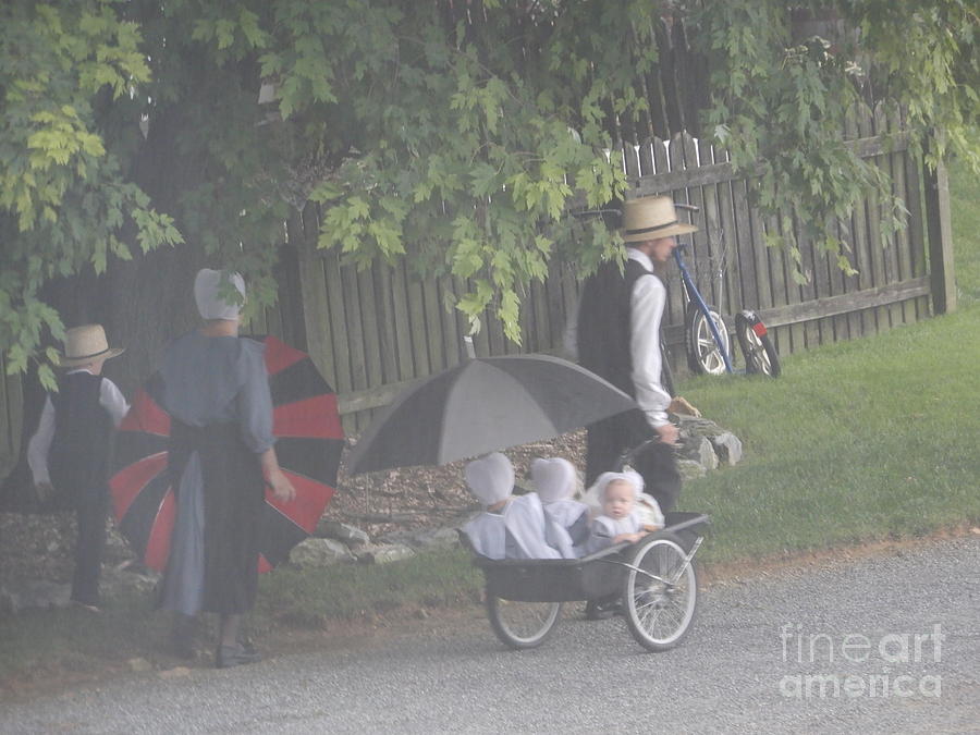An Amish Family Walks to Church #1 Photograph by Christine Clark