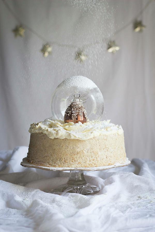 An Angel Cake With A Snowglobe And Brandy Butter Icing For Christmas #1 Photograph by Great Stock!