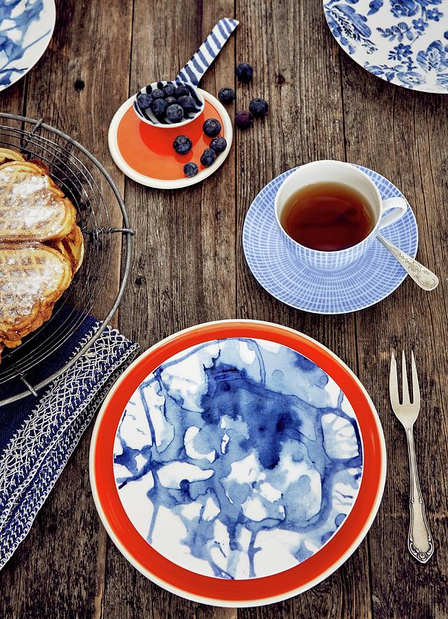 An East Frisian Teatime Meal With A Waffle Heart, Blueberries And Tea #1 Photograph by Nina Struve