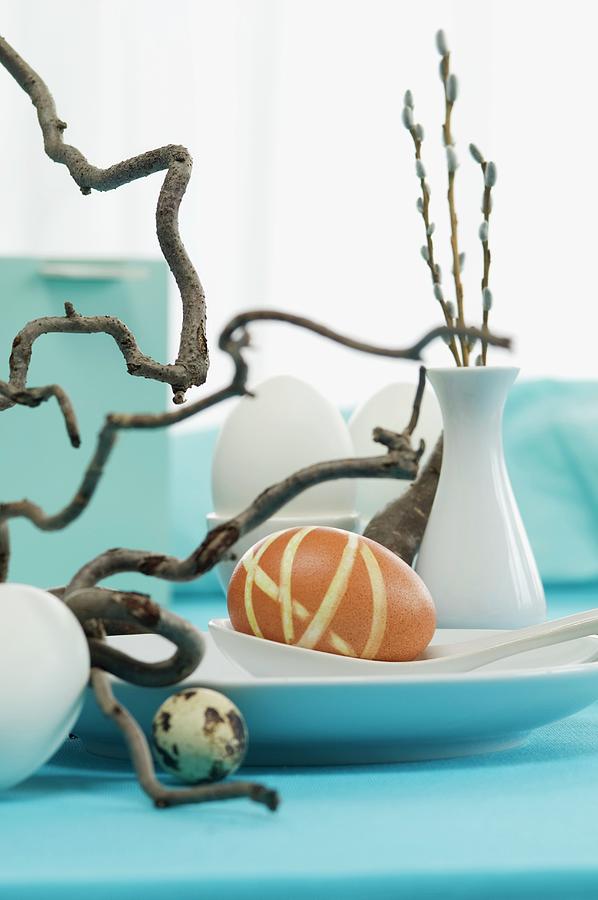 An Easter Table Decoration With Eggs And Corkscrew Willow #1 Photograph by Achim Sass