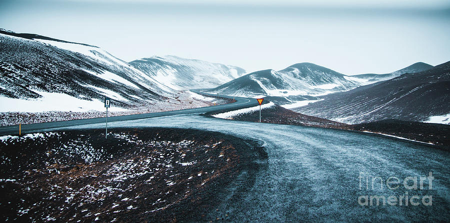 Asphalt mountain roads crossing dangerous Icelandic passes during a trip. #1 Photograph by Joaquin Corbalan