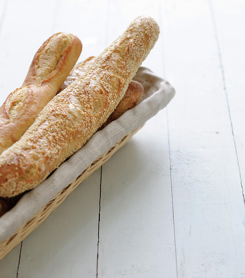 Assortment Of Baguettes In A Bread Basket #1 Photograph by Carnet