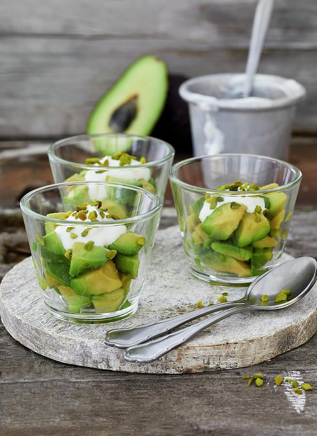 Avocado With A Lime And Yoghurt Dip And Honeyed Pistachios #1 Photograph by Stefan Schulte-ladbeck