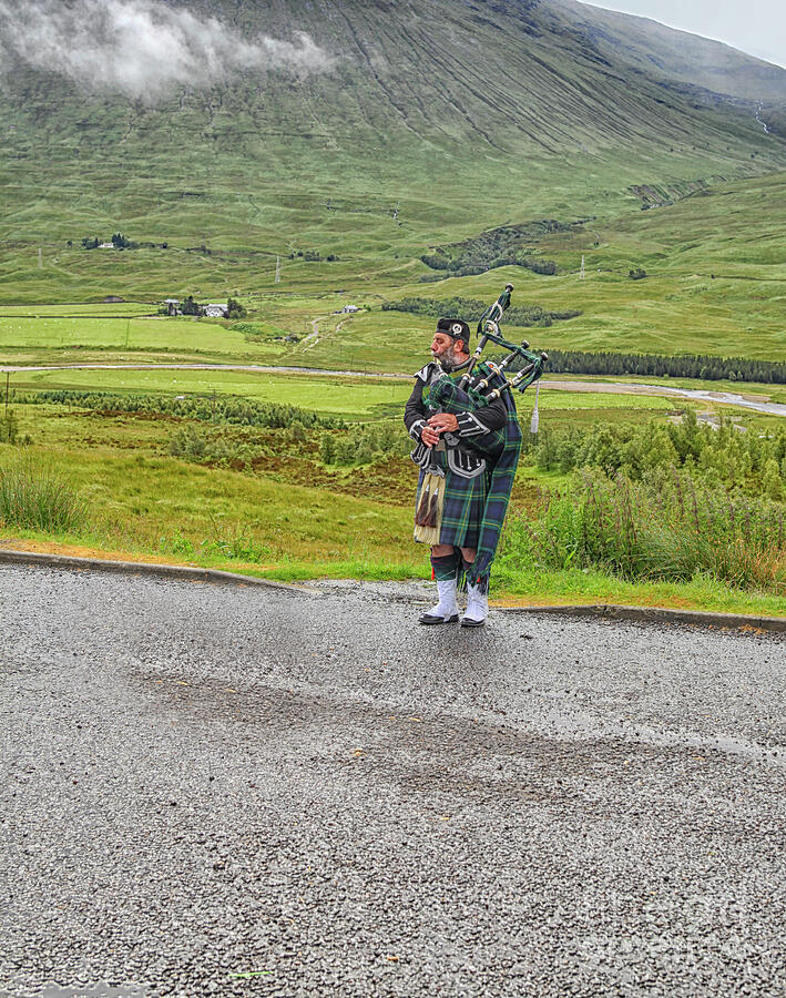 Bagpiping busker  Photograph by Patricia Hofmeester