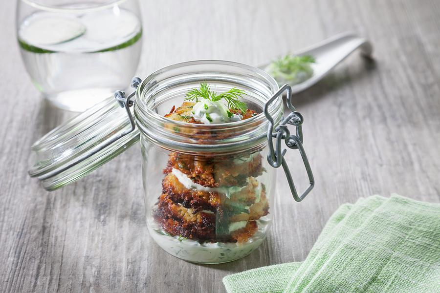 Baked Aubergines With Tzatziki In A Glass Jar #1 Photograph by Younes Stiller