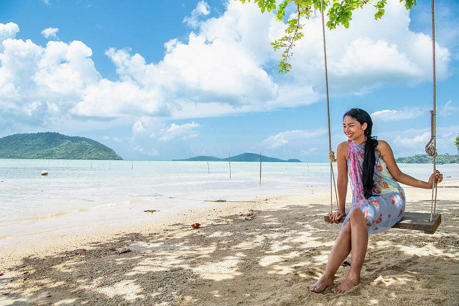 Beautiful Woman Sitting On A Swing At The Beach In Phuket Photograph By 