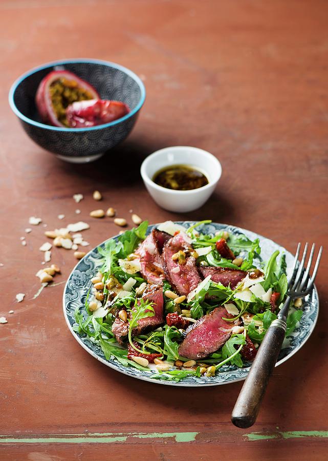 Beef Steak With Rocket, Dried Tomatoes And Passionfruit & Balsamic Vinegar Dressing #1 Photograph by Ewgenija Schall