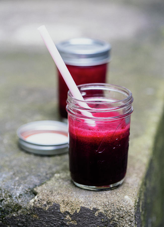 Beetroot Juice In A Jar With A Straw #1 Photograph by Jennifer Braun