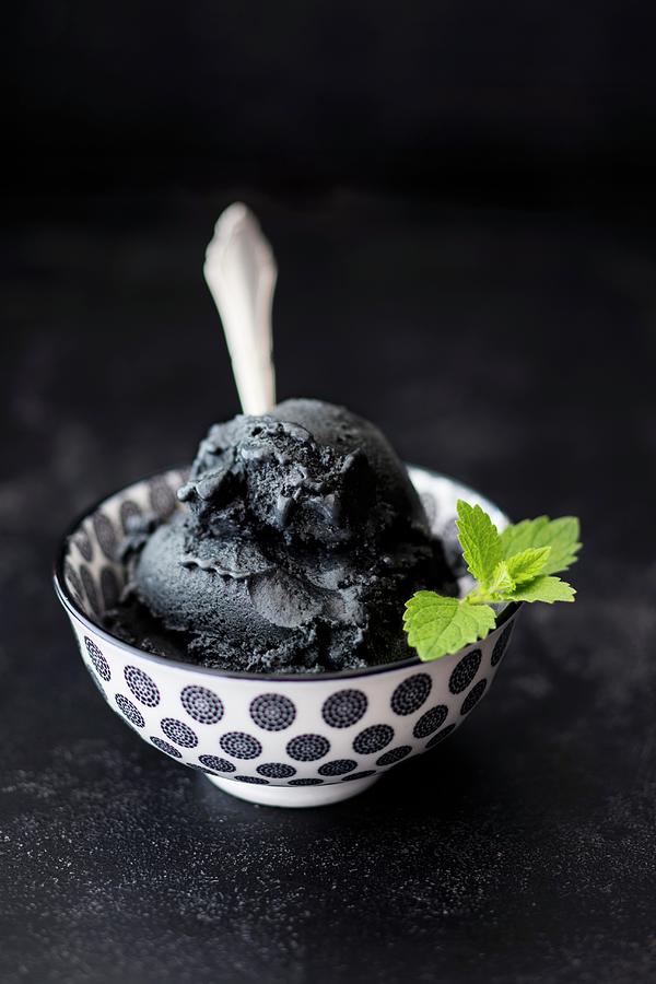 Black Ice Cream With Vanilla #1 Photograph by Jan Wischnewski