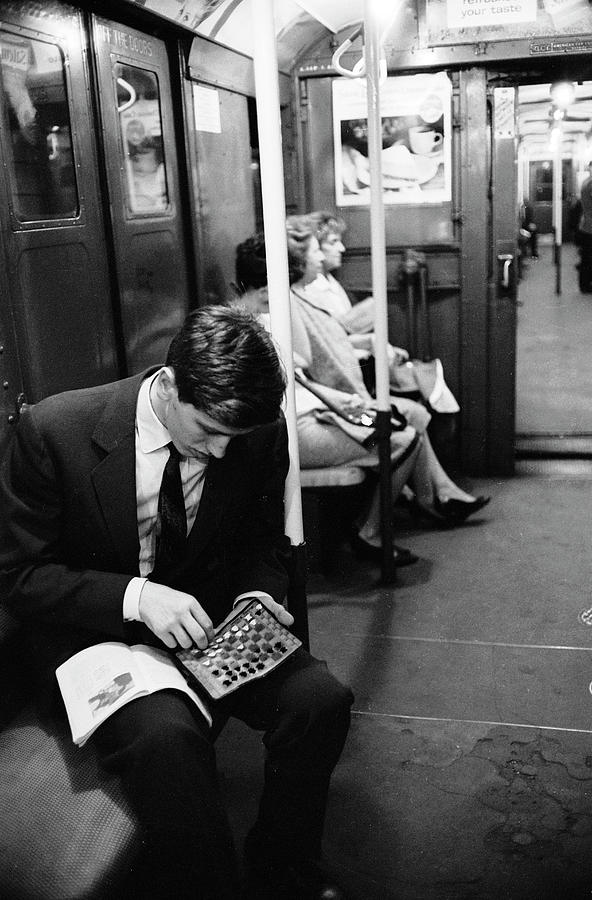 Black And White Photograph - Bobby Fischer On The Subway #1 by Carl Mydans