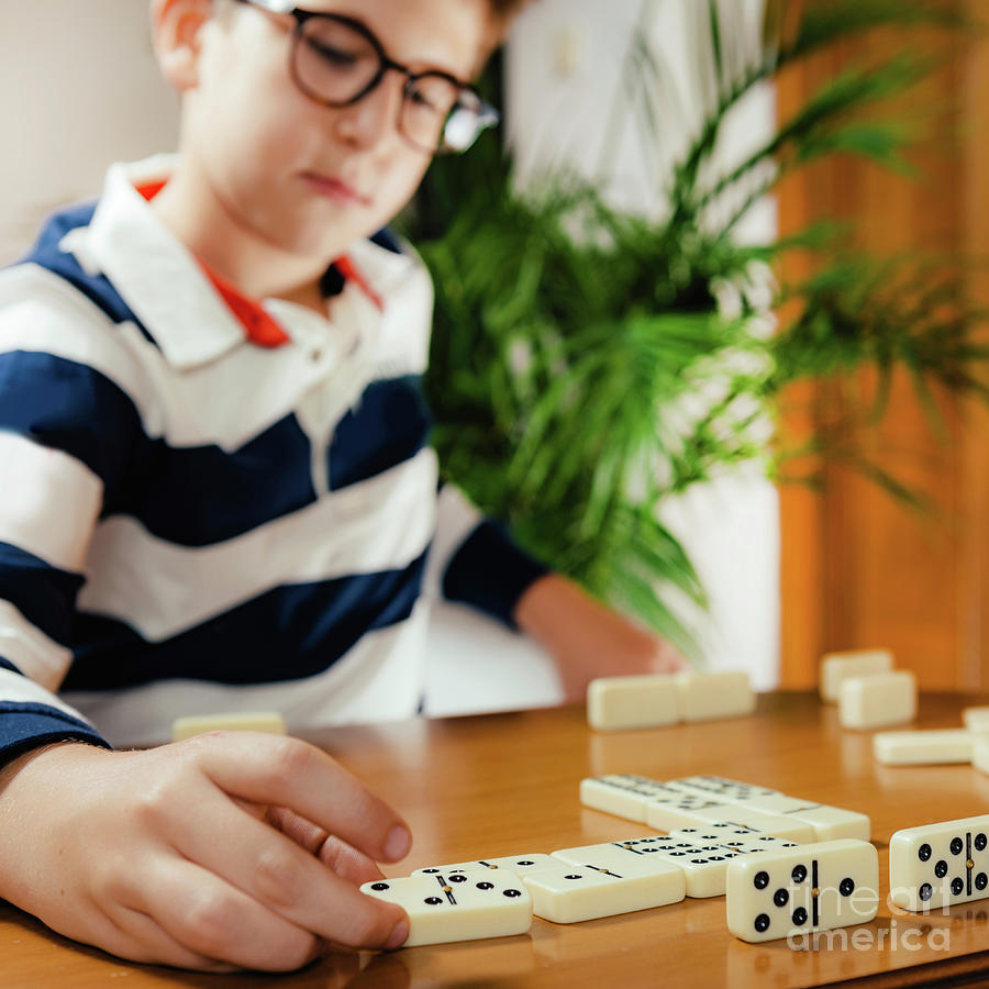 Boy Playing Dominoes #1 Photograph by Microgen Images/science Photo Library