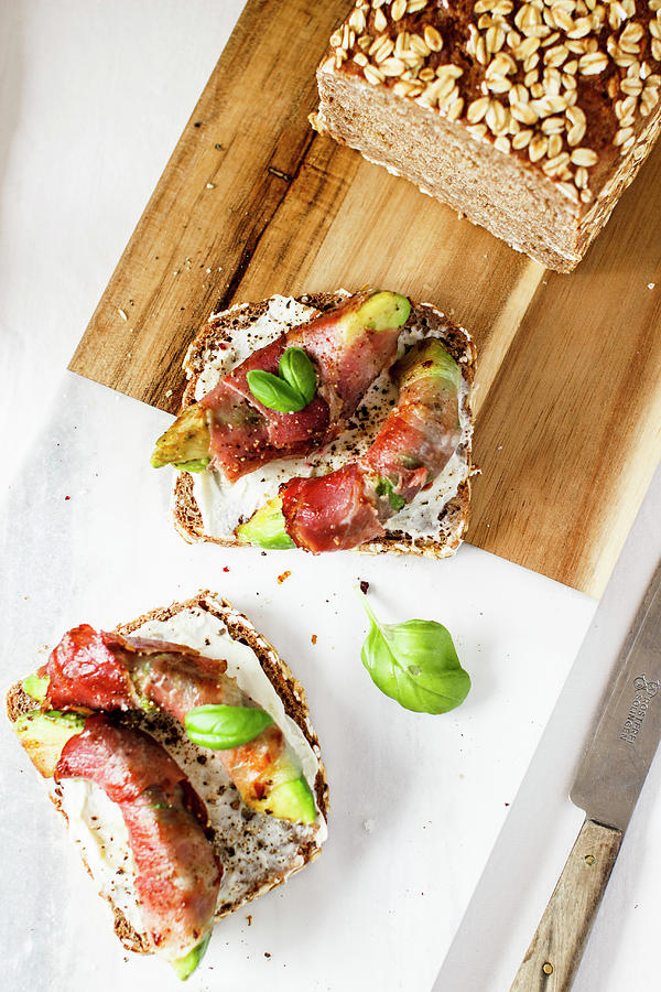 Bread Topped With Avocado And Bacon #1 Photograph by Annalena Bokmeier