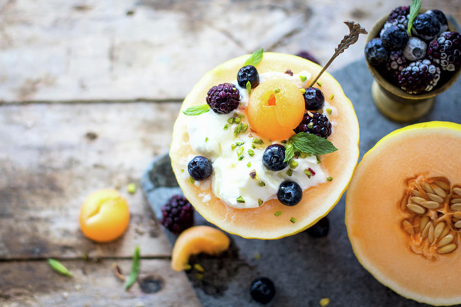 Breakfast Melon Bowl With Yogurt, Blueberries, Blackberries #1 Photograph by Lana Konat