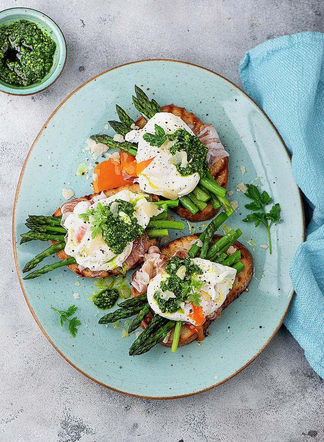 Bruschetta Topped With Asparagus And Poached Egg #1 Photograph by Ewgenija Schall