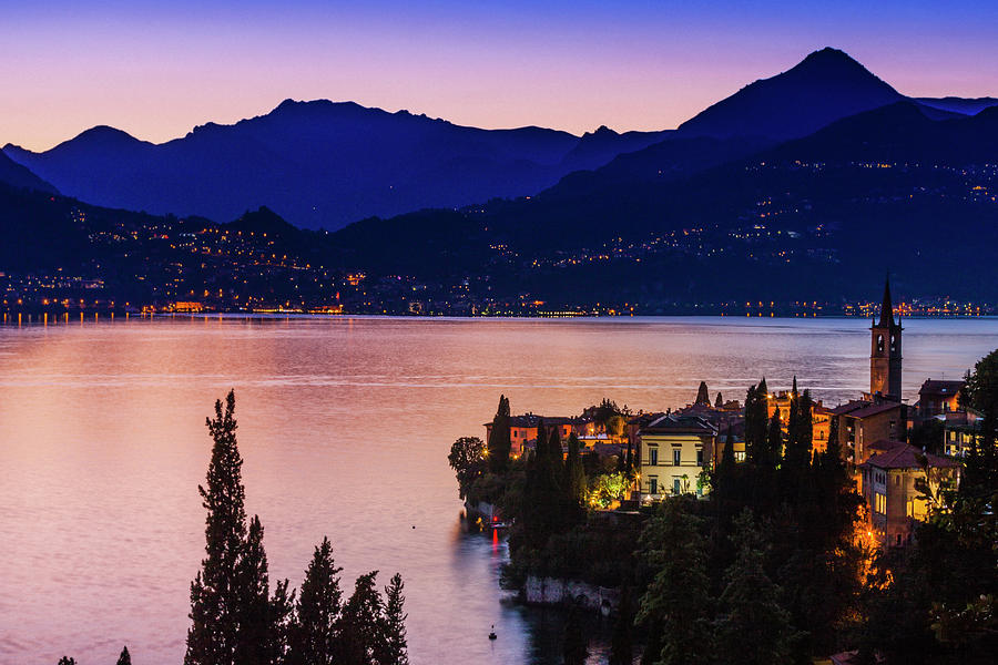 Buildings Illuminated At Sunset By Lake Como, Varenna, Italy Digital ...