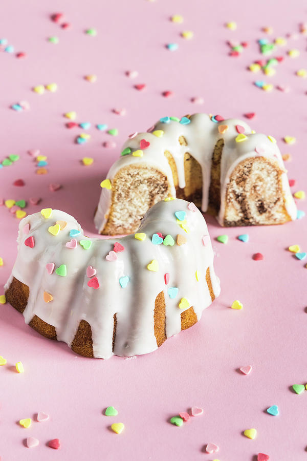 Bundt Cake With White Glaze And Colorful Heart Shaped Sugar Sprinkles For Valentines Day #1 Photograph by Alla Machutt