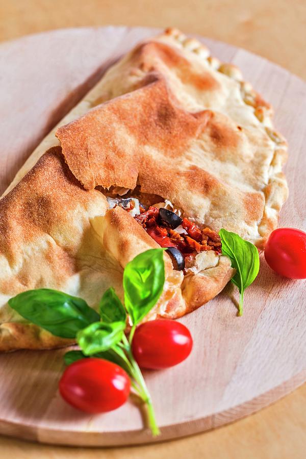 Calzone Caprese pizza Pocket With Tomatoes And Mozzarella, Italy #1 Photograph by Lukasz Zandecki