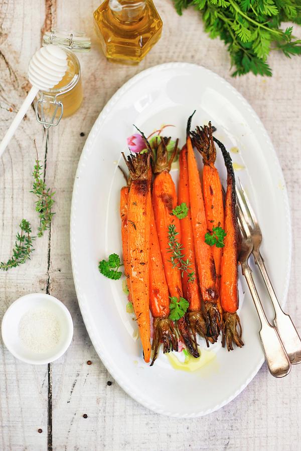 Caramelised Carrots With Honey And Thyme #1 Photograph by Claudia Gargioni