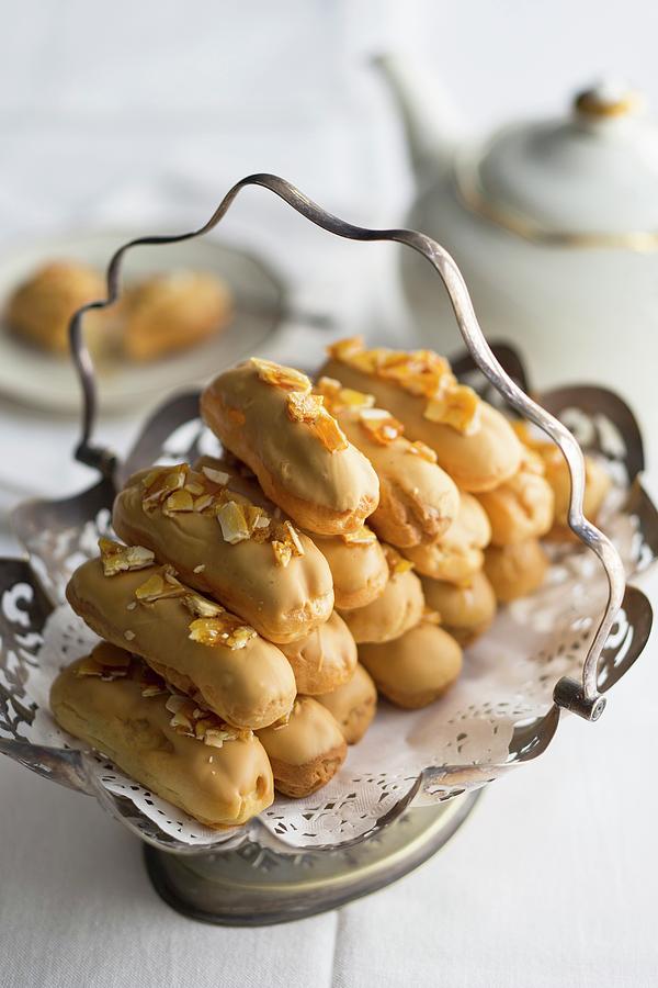 Caramelised White Chocolate Eclairs With Almond Milk Cream And Salted Almond Brittle Served With Tea #1 Photograph by Great Stock!